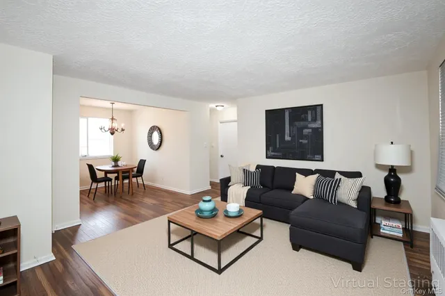 a living room with furniture and a table