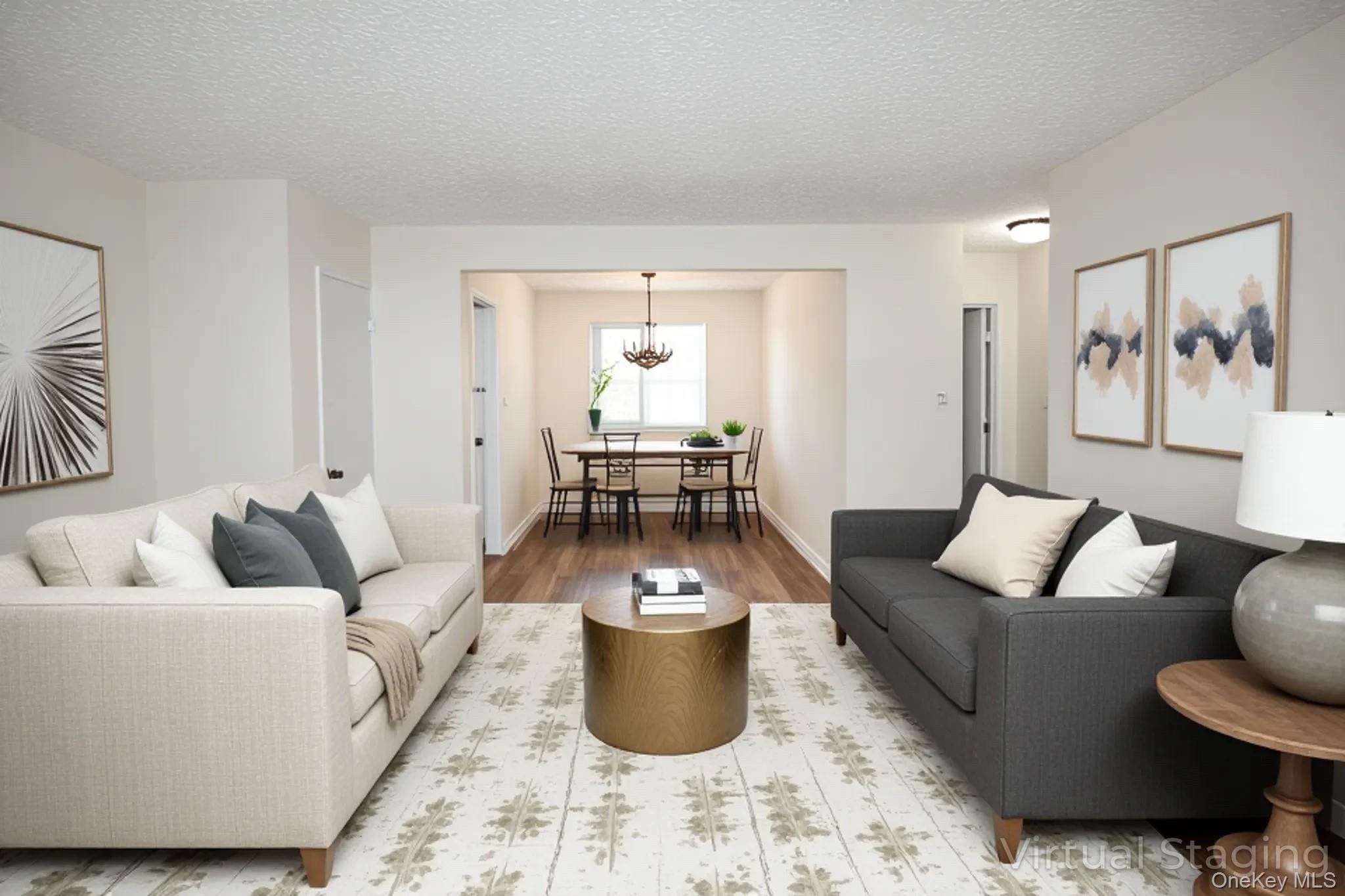 220-04 Stronghurst Avenue, Unit 185 Queens, NY 11427 - Photo 5 of 33 a living room with furniture and a large window