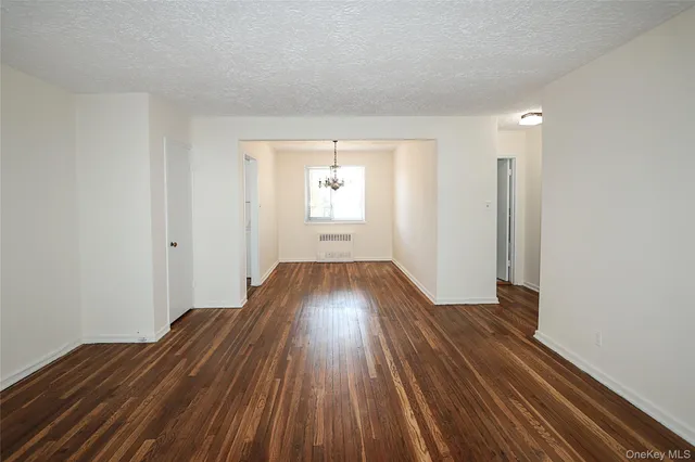 wooden floor in a hall with an entryway