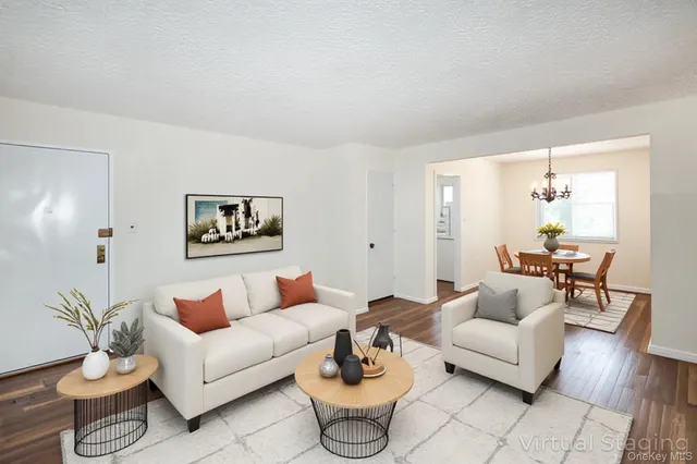 a living room with furniture and a large window