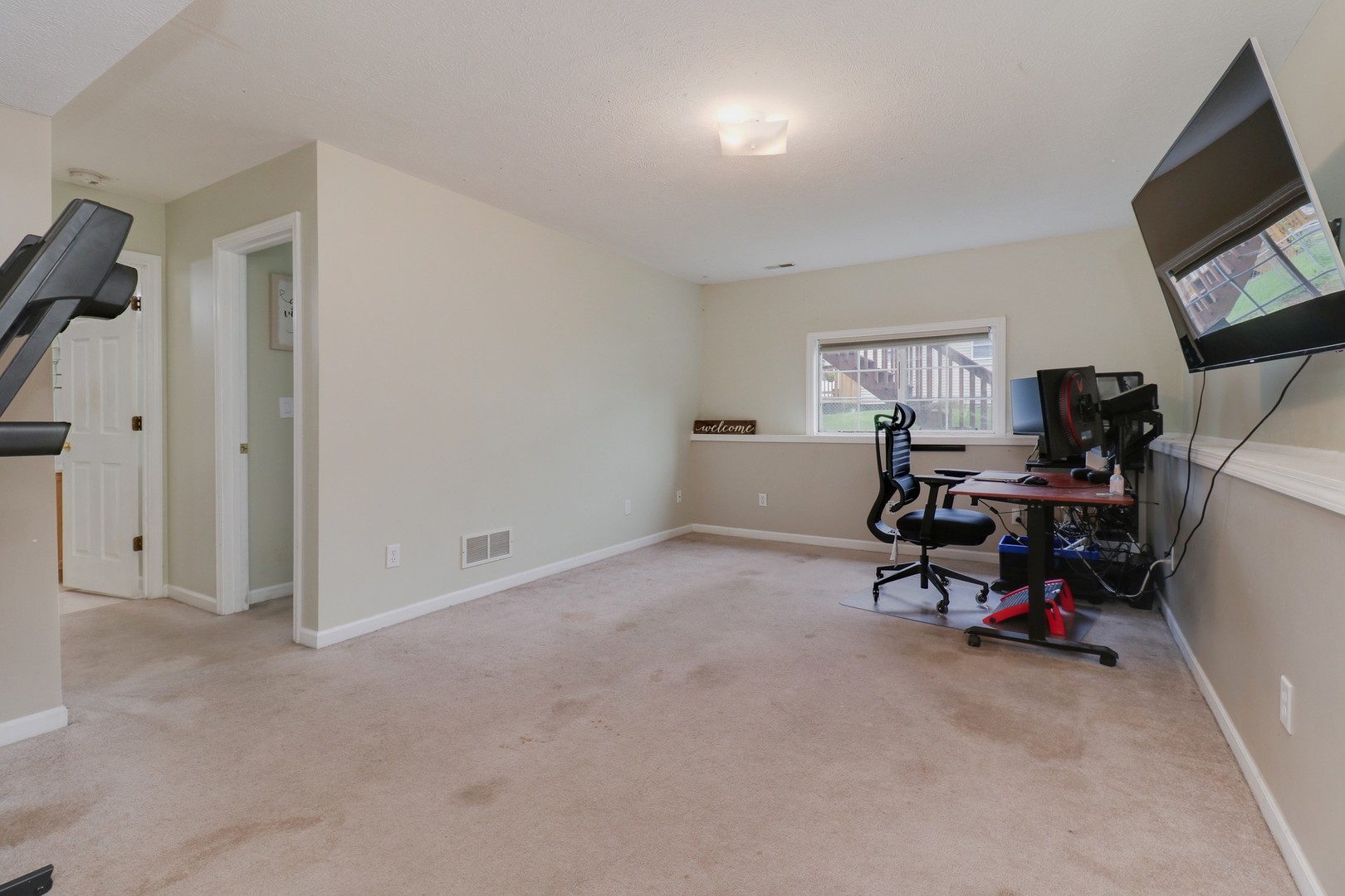 248 Parktrail Road Normal, IL 61761 - Photo 17 of 27 a view of a livingroom with workspace and a window