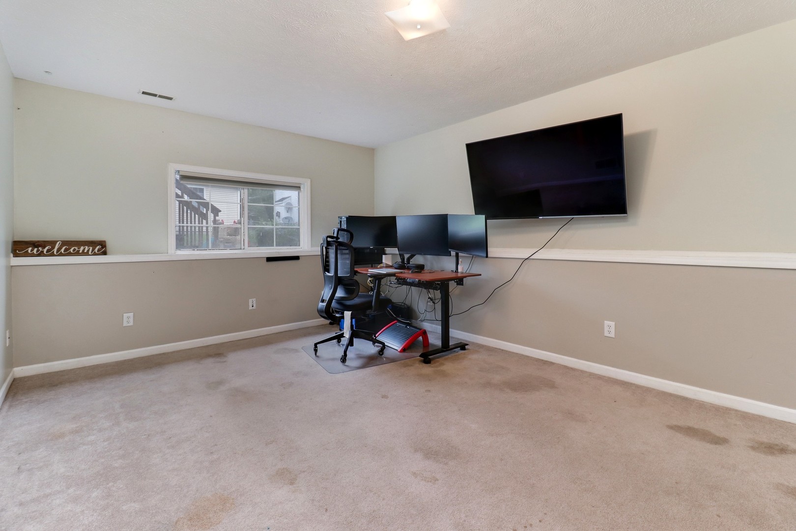248 Parktrail Road Normal, IL 61761 - Photo 19 of 27 a living room with furniture and a flat screen tv