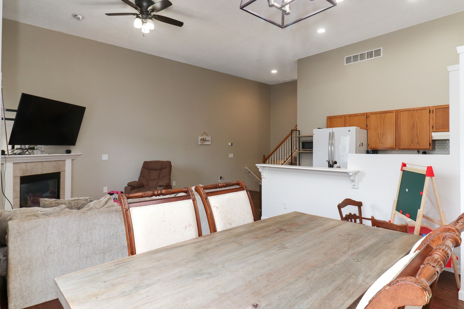 248 Parktrail Road Normal, IL 61761 - Photo 9 of 27 a living room with furniture and a flat screen tv