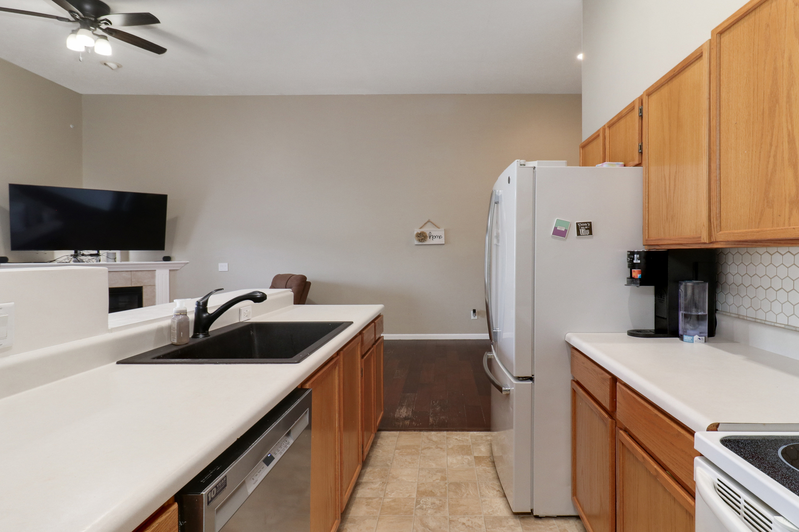 248 Parktrail Road Normal, IL 61761 - Photo 10 of 27 a kitchen with a sink and a refrigerator