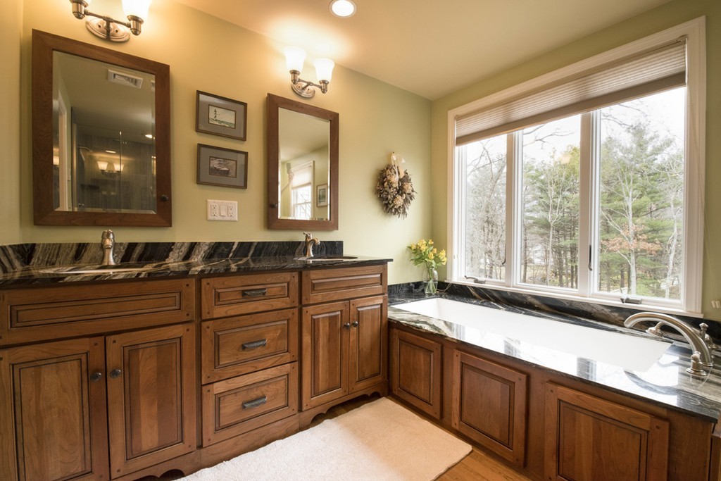 10 Burroughs Road Lexington, MA 02420 - Photo 7 of 16 a spacious bathroom with a granite countertop sink and a large mirror