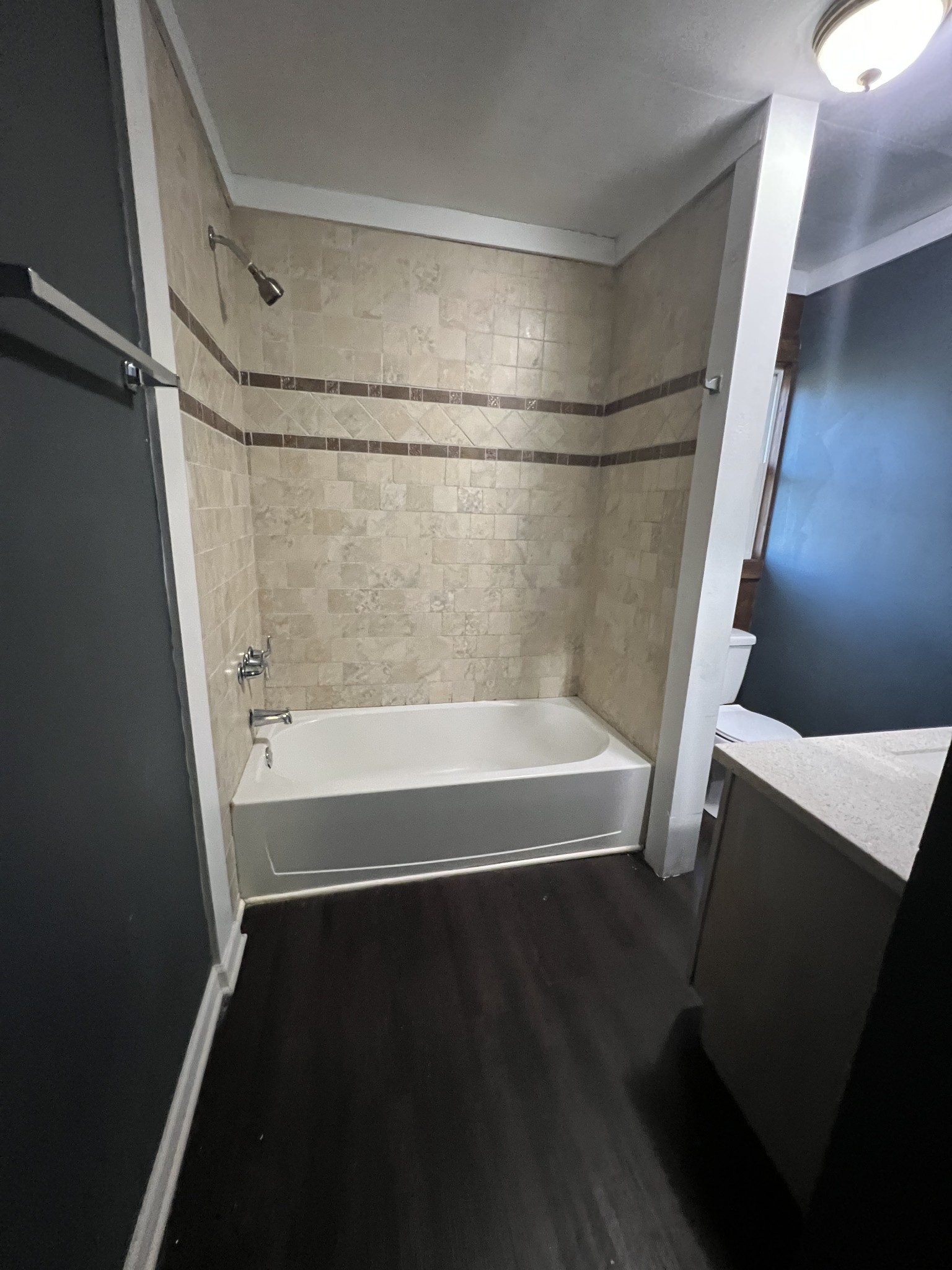 405 North 2nd Street Decherd, TN 37324 - Photo 7 of 11 a bathroom with a bathtub and a shower