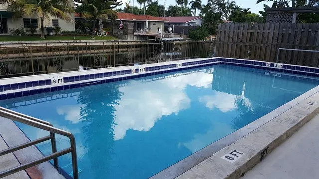 a view of a swimming pool with a lake view