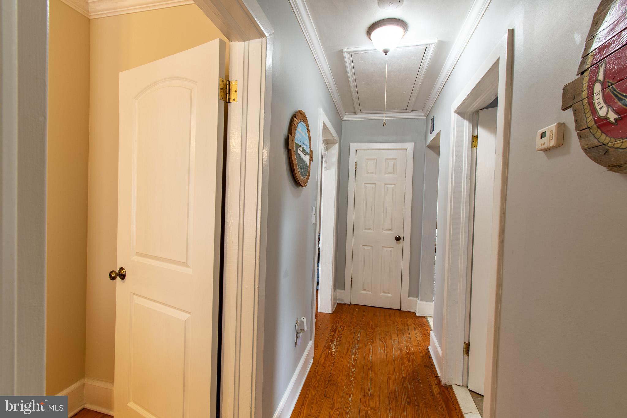 9 Oak Street Cambridge, MD 21613 - Photo 19 of 29 a view of a hallway with wooden floor