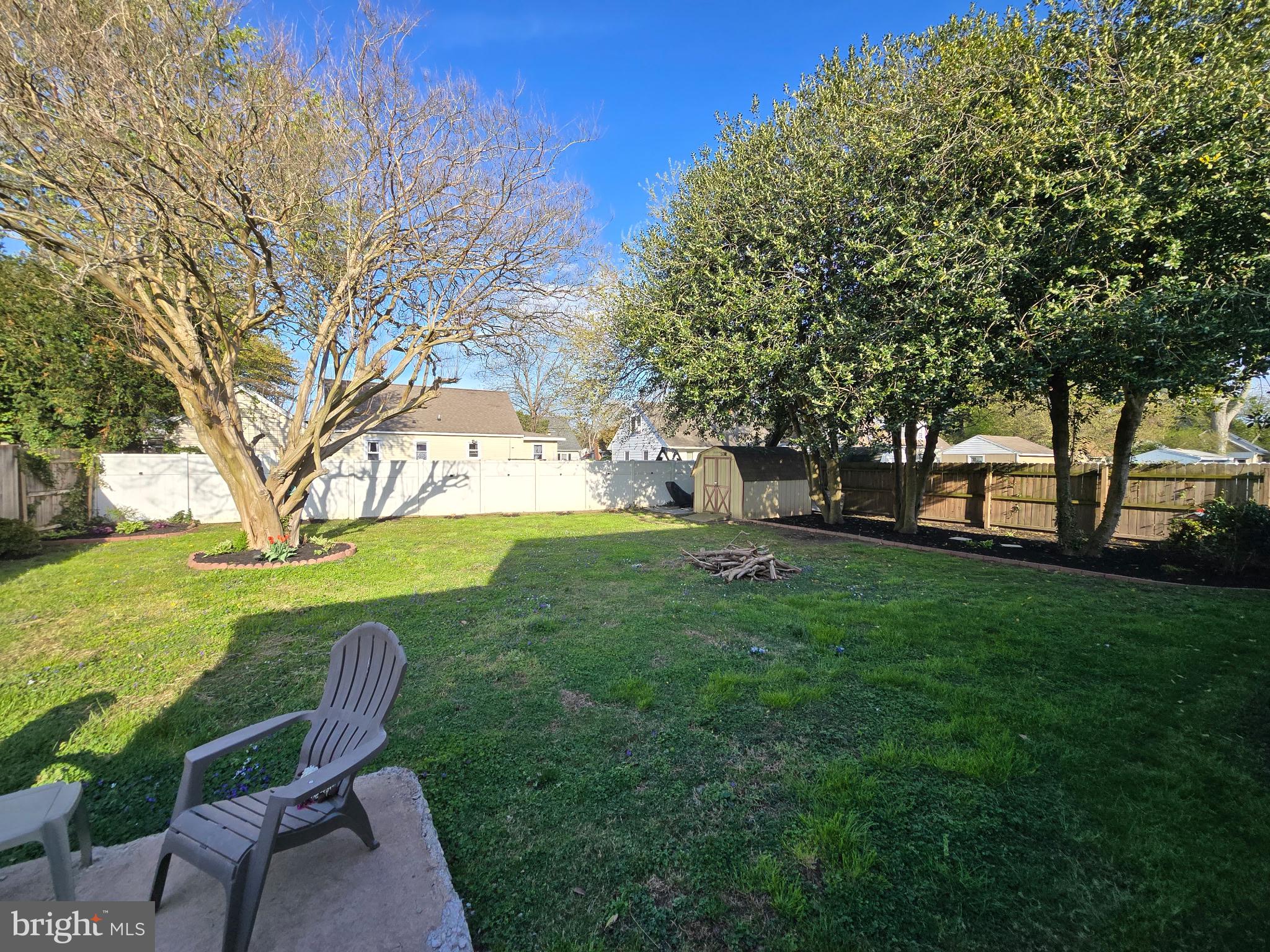 9 Oak Street Cambridge, MD 21613 - Photo 21 of 29 a view of backyard with outdoor seating and green space