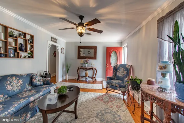 a view of a livingroom with furniture and workspace