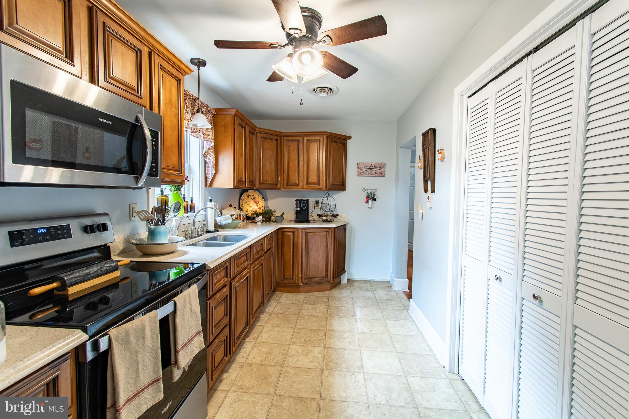 9 Oak Street Cambridge, MD 21613 - Photo 8 of 29 a kitchen with stainless steel appliances granite countertop a stove and a sink