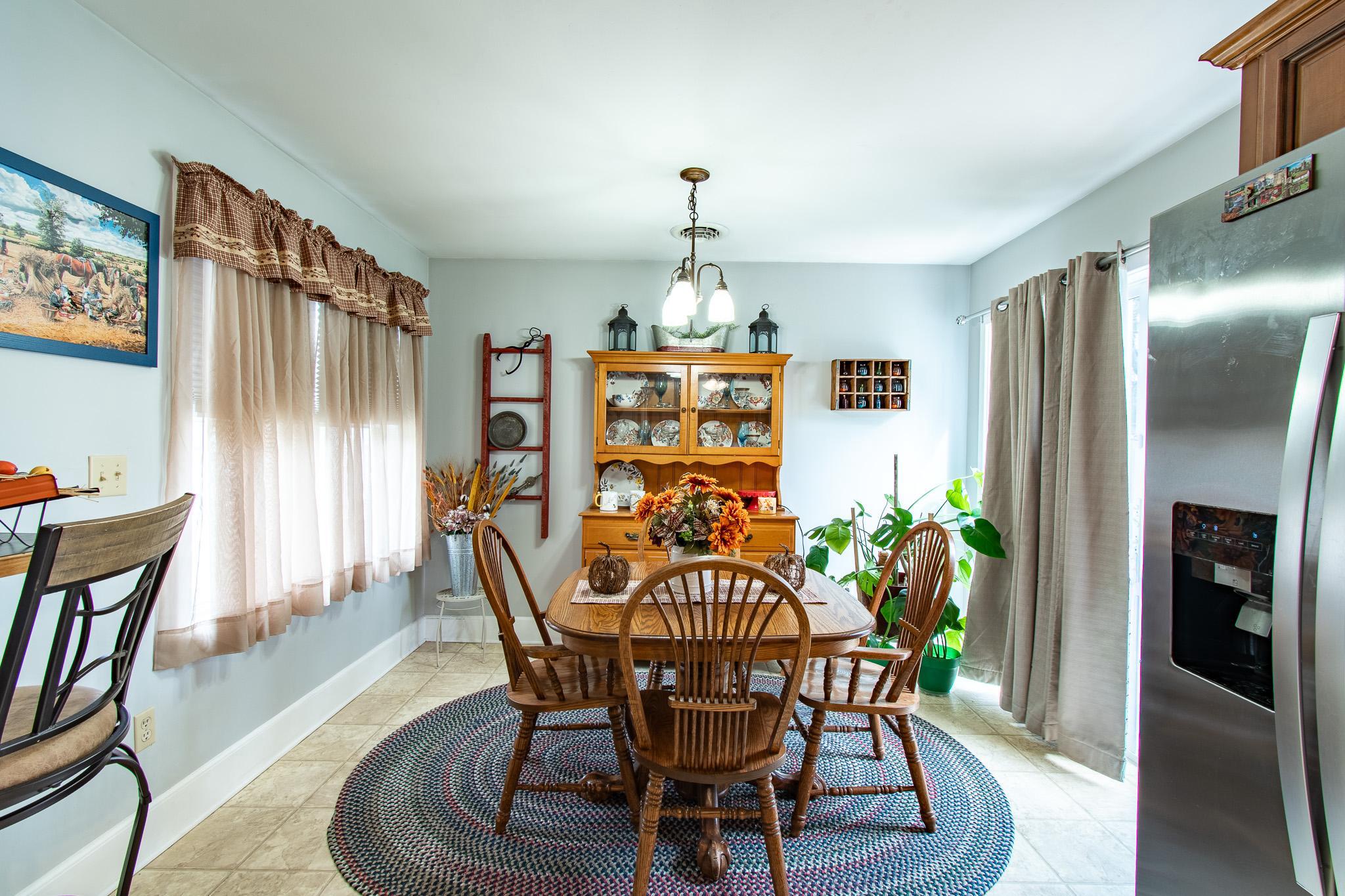 9 Oak Street Cambridge, MD 21613 - Photo 10 of 29 a view of a dining room with furniture window and wooden floor