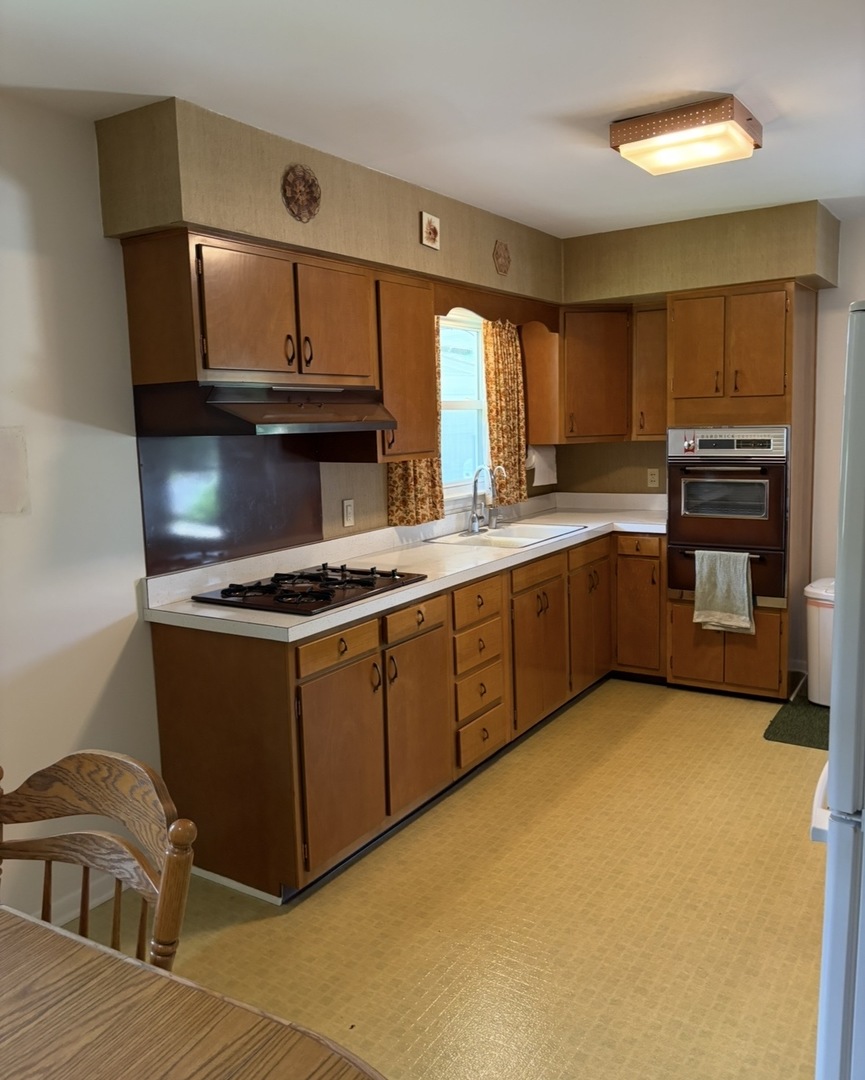 609 9th Avenue Ottawa, IL 61350 - Photo 14 of 28 a kitchen with stainless steel appliances granite countertop a stove a sink and a microwave