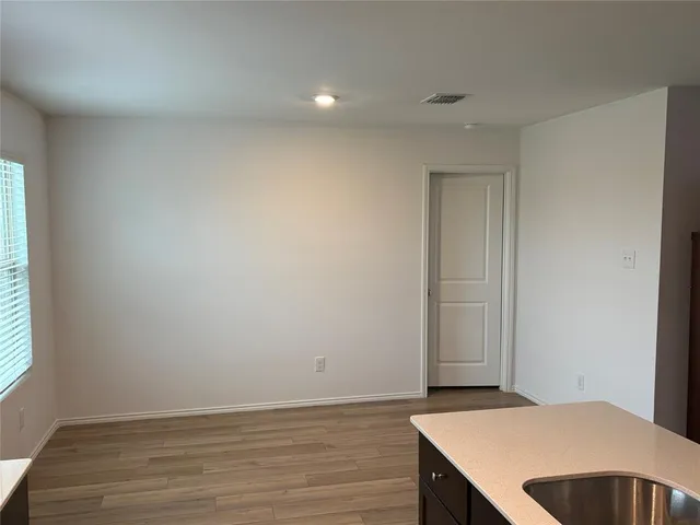 a view of livingroom with hardwood floor and hallway