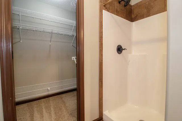 a bathroom with a glass shower door