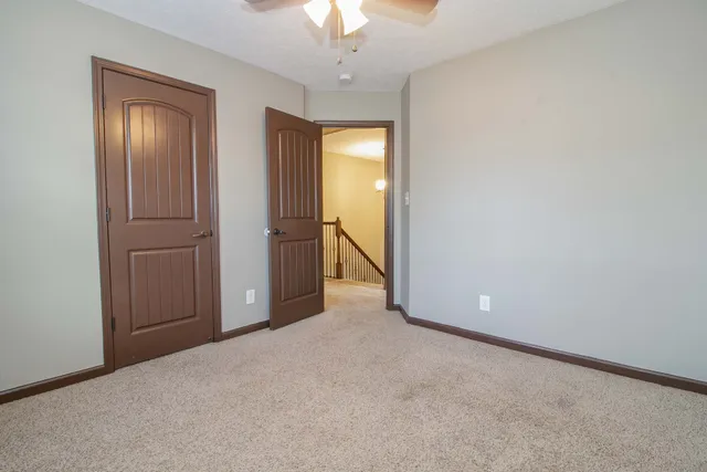 a view of an empty room with a bathroom