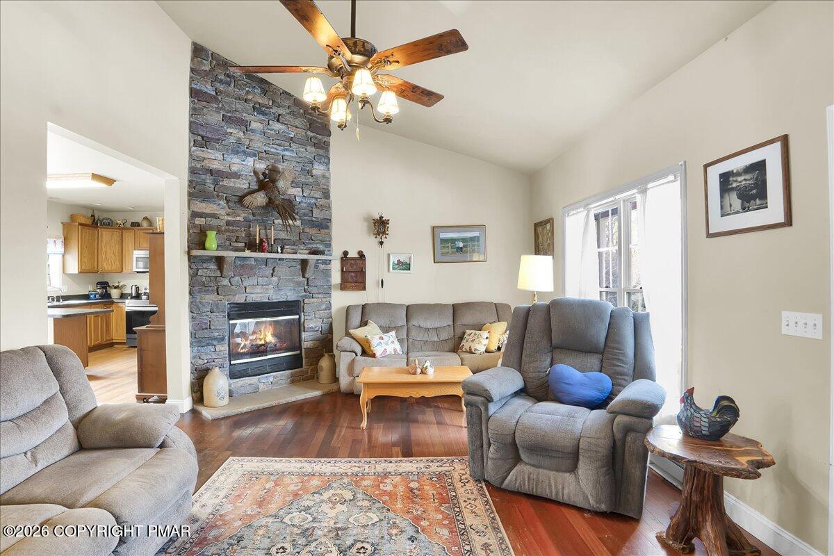271 Church Road Jim Thorpe, PA 18229 - Photo 3 of 51 a living room with furniture a fireplace and a flat screen tv