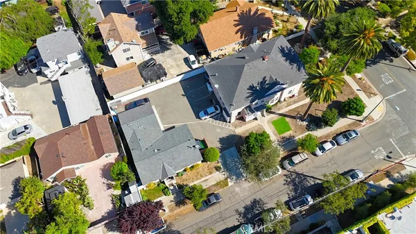 an aerial view of residential houses with outdoor space
