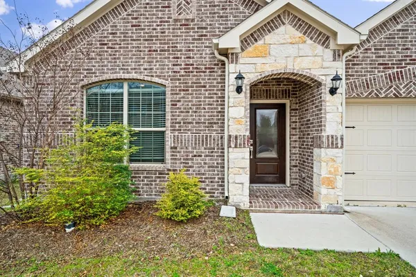 a view of hallway with wooden floor