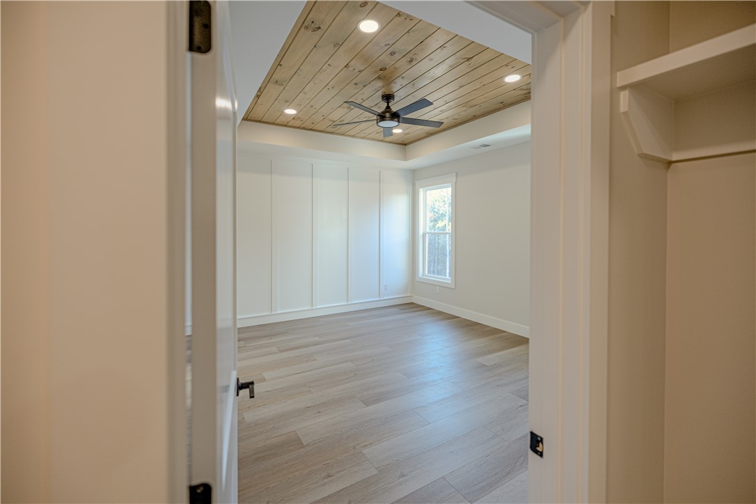 1409 Stonehurst Road Anderson, SC 29621 - Photo 18 of 37 This spacious room features a unique wood-paneled ceiling and elegant plank flooring.