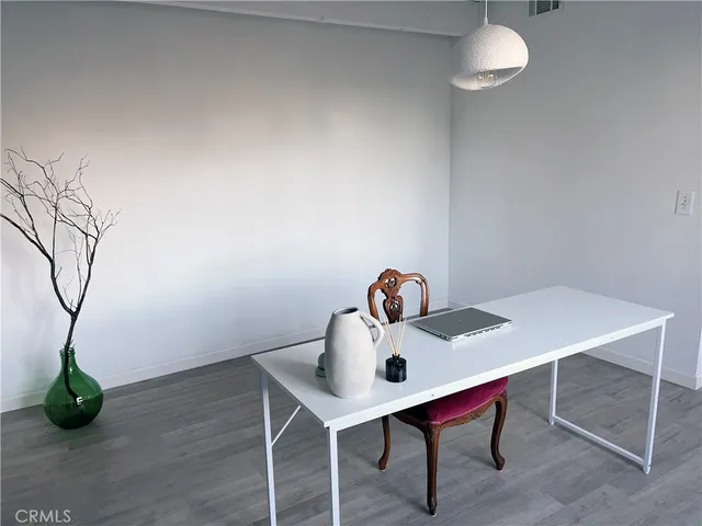 a room with a table and chairs