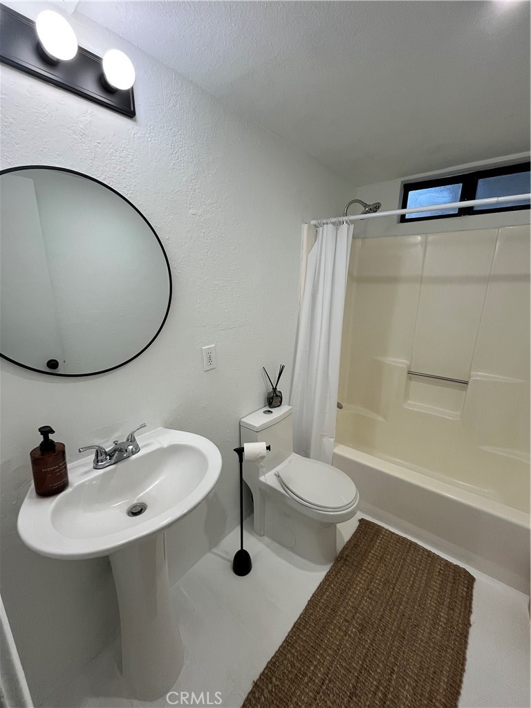 24875 Marion Ridge Drive Idyllwild, CA 92549 - Photo 24 of 47 a bathroom with a sink a toilet and a mirror