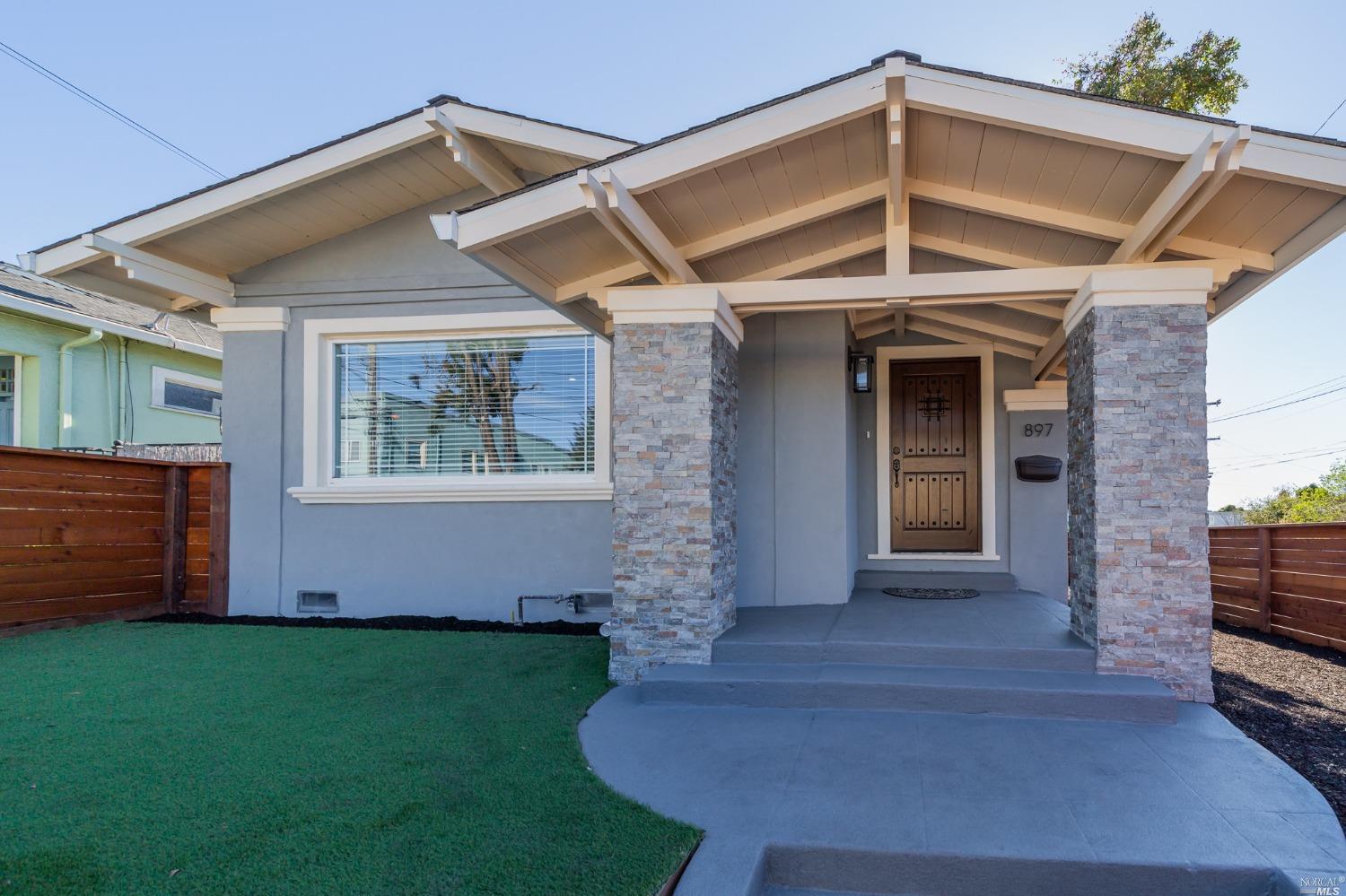 897 45th Street Oakland, CA 94608 - Photo 1 of 1 a front view of a house with garden