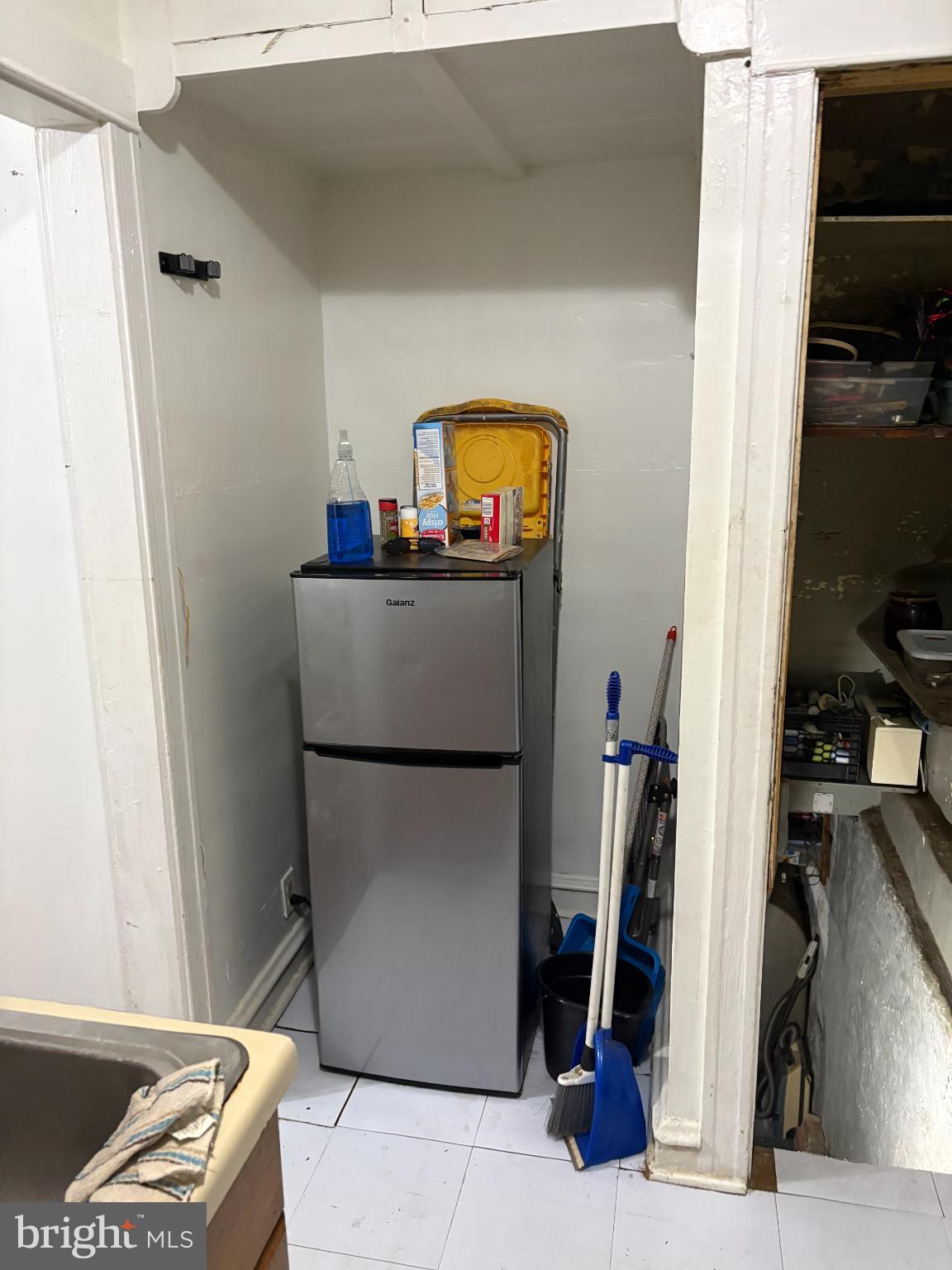 2419 Upland Street Chester, PA 19013 - Photo 11 of 27 Compact kitchen corner with essential appliances.