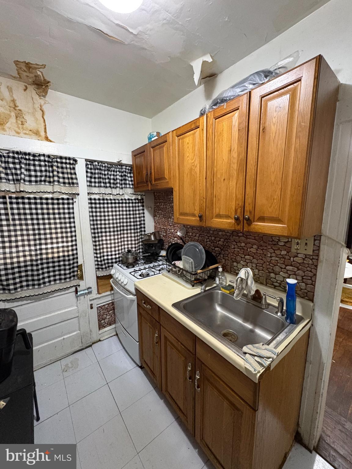 2419 Upland Street Chester, PA 19013 - Photo 13 of 27 Cozy kitchen with rustic charm and character.