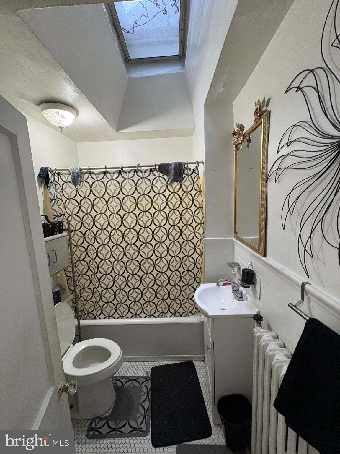 2419 Upland Street Chester, PA 19013 - Photo 16 of 27 Charming bathroom with skylight and decor.