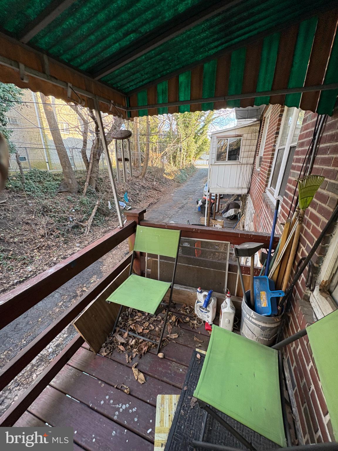 2419 Upland Street Chester, PA 19013 - Photo 22 of 27 Charming porch with a serene woodland view.