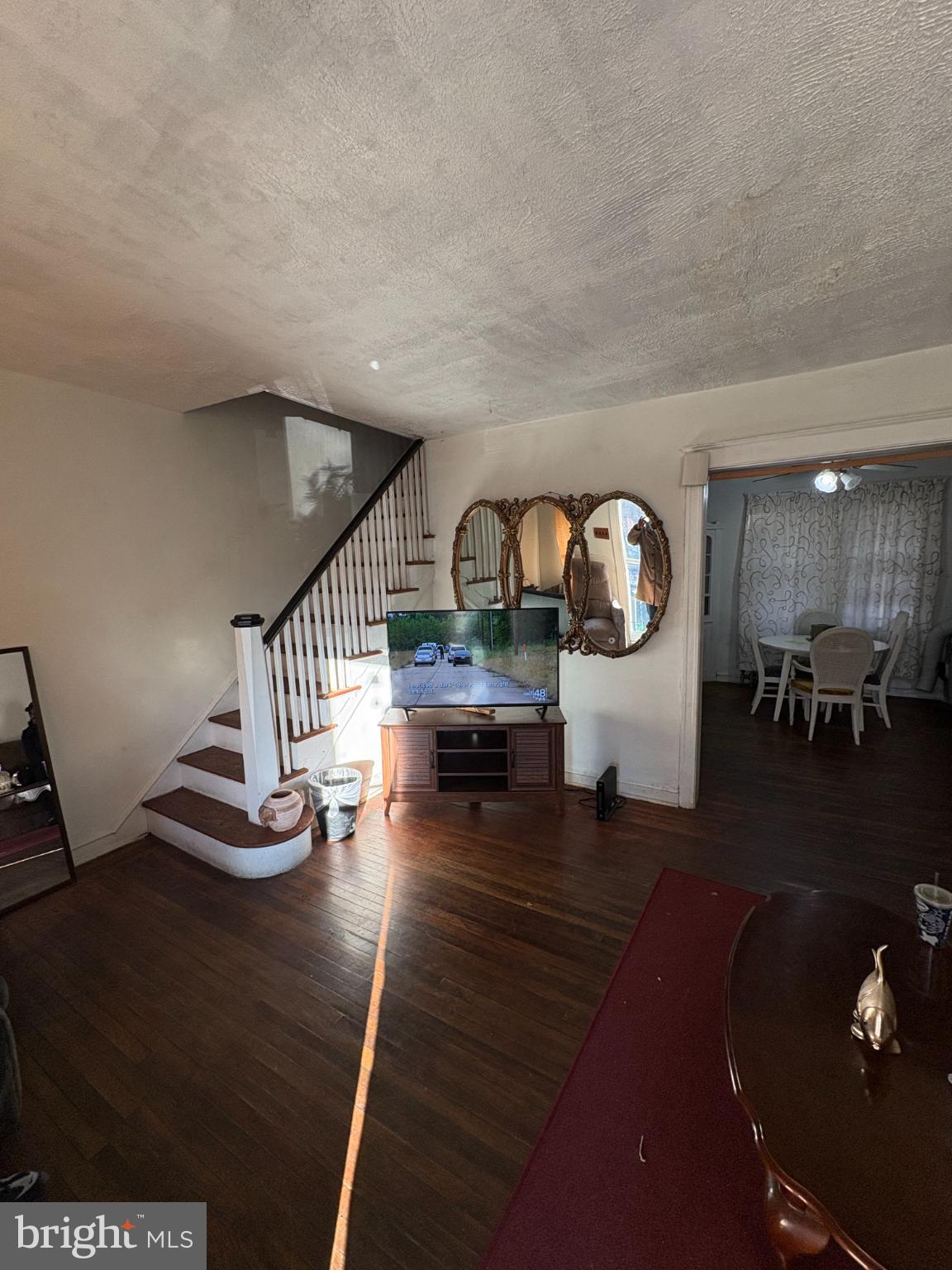 2419 Upland Street Chester, PA 19013 - Photo 4 of 27 Inviting space with charming staircase allure.