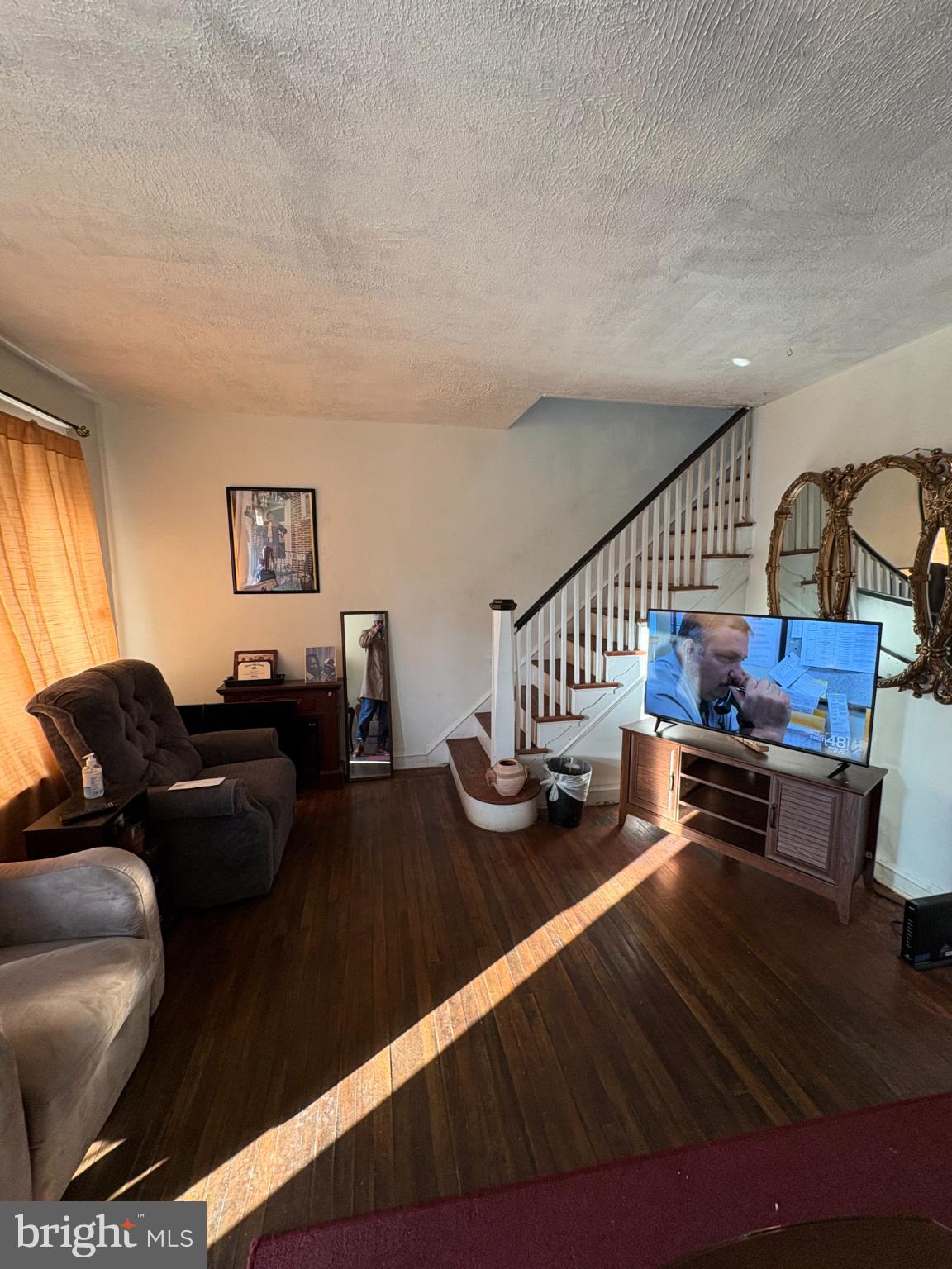 2419 Upland Street Chester, PA 19013 - Photo 5 of 27 Cozy living space with warm sunlight.