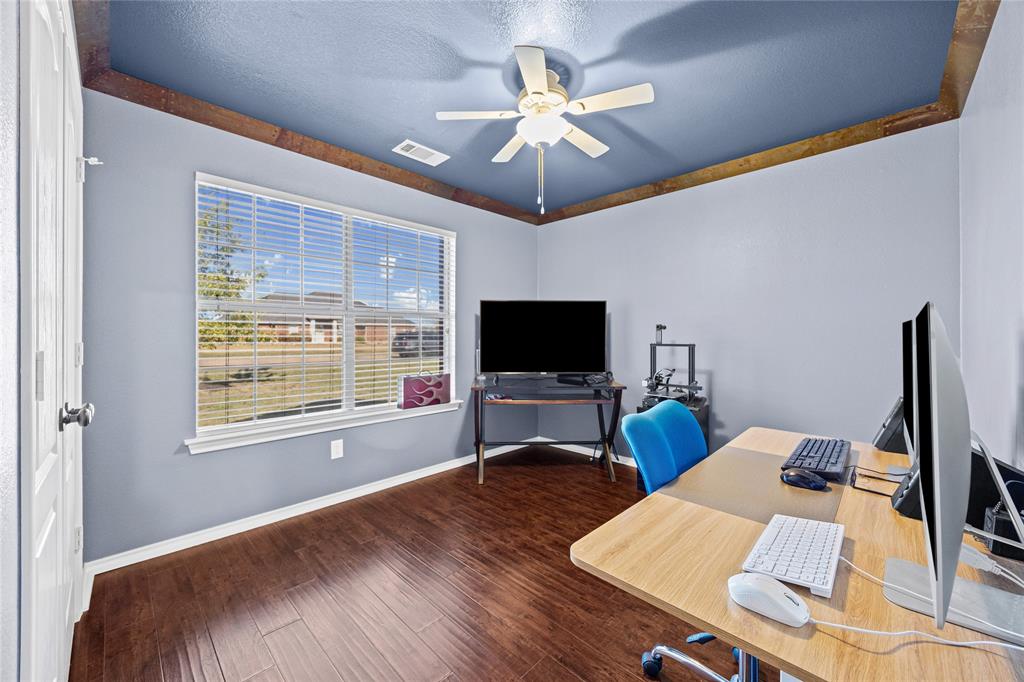 112 Springfield Lane Red Oak, TX 75165 - Photo 24 of 40 a view of a livingroom with workspace and a window
