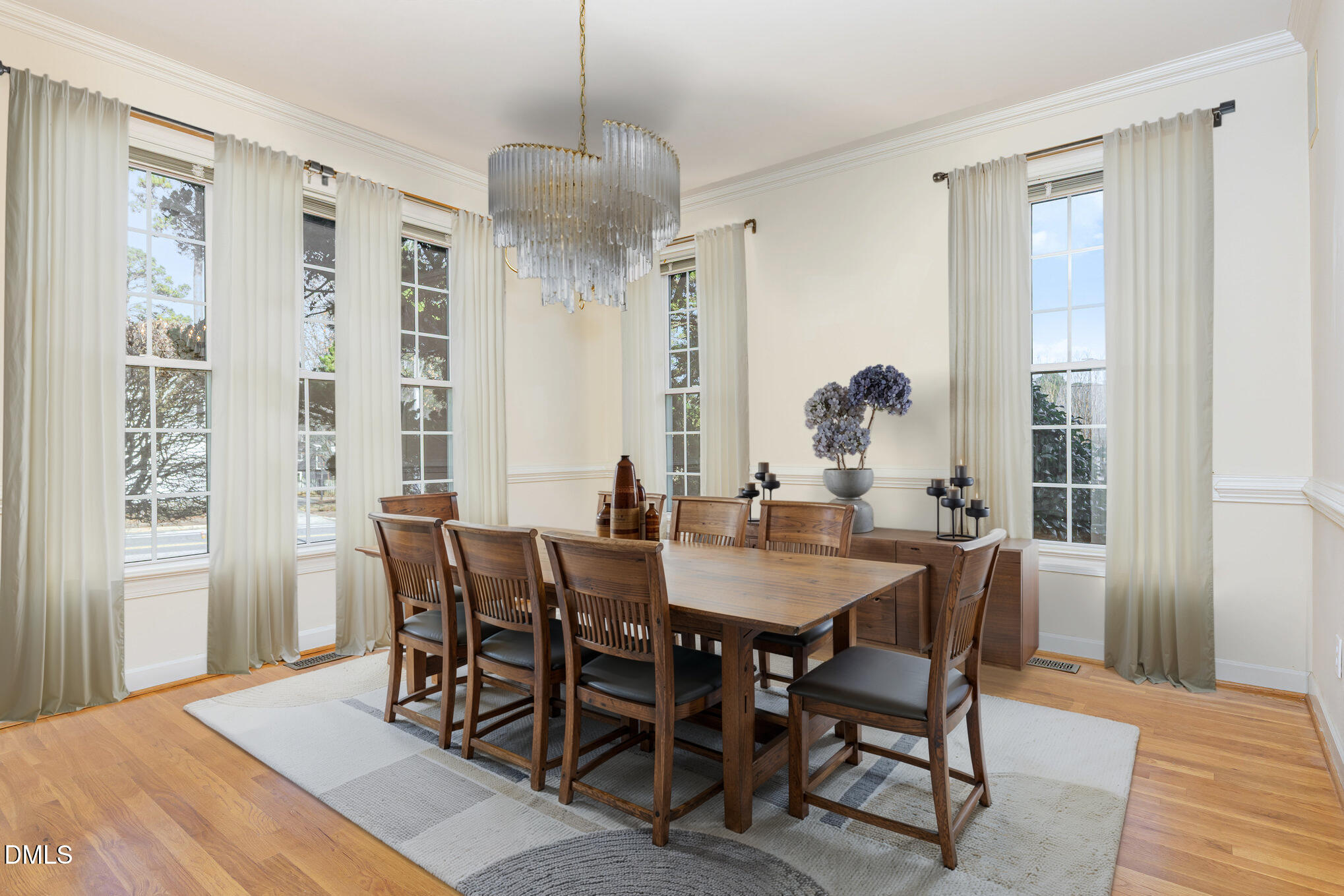 712 Hardimont Road Raleigh, NC 27609 - Photo 10 of 40 a view of a dining room with furniture window and wooden floor