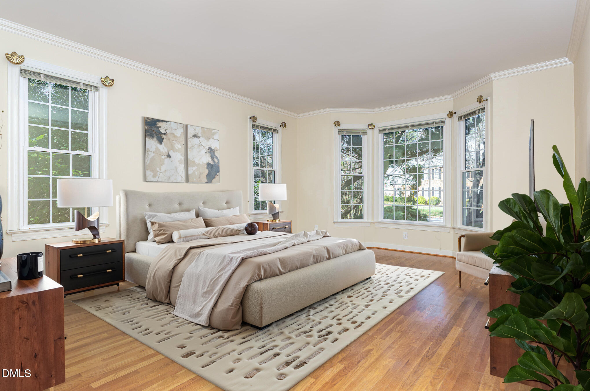 712 Hardimont Road Raleigh, NC 27609 - Photo 18 of 40 a bedroom with a large bed and a large window