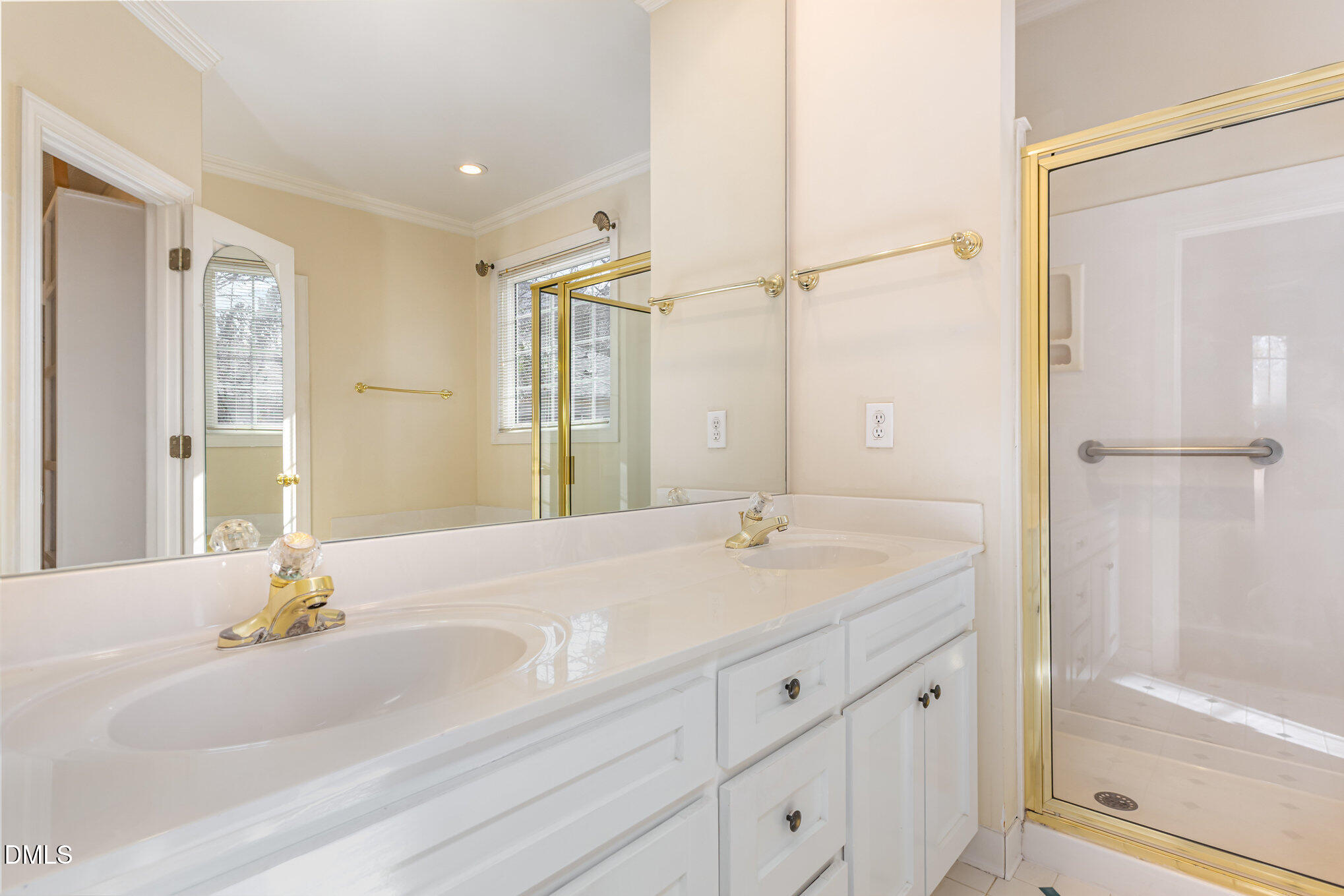 712 Hardimont Road Raleigh, NC 27609 - Photo 22 of 40 a bathroom with a granite countertop sink and a mirror
