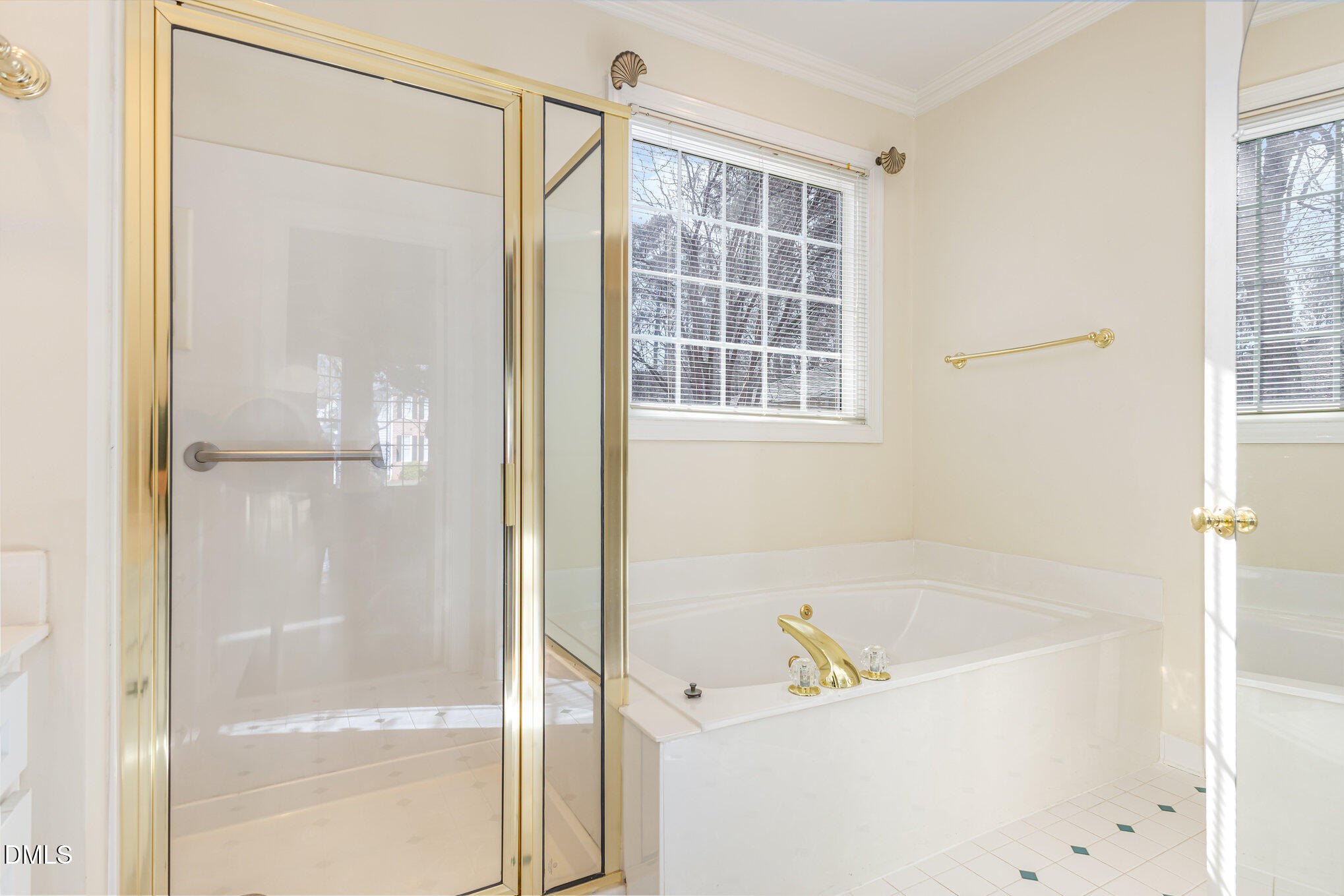 712 Hardimont Road Raleigh, NC 27609 - Photo 23 of 40 a bathroom with a tub and a shower