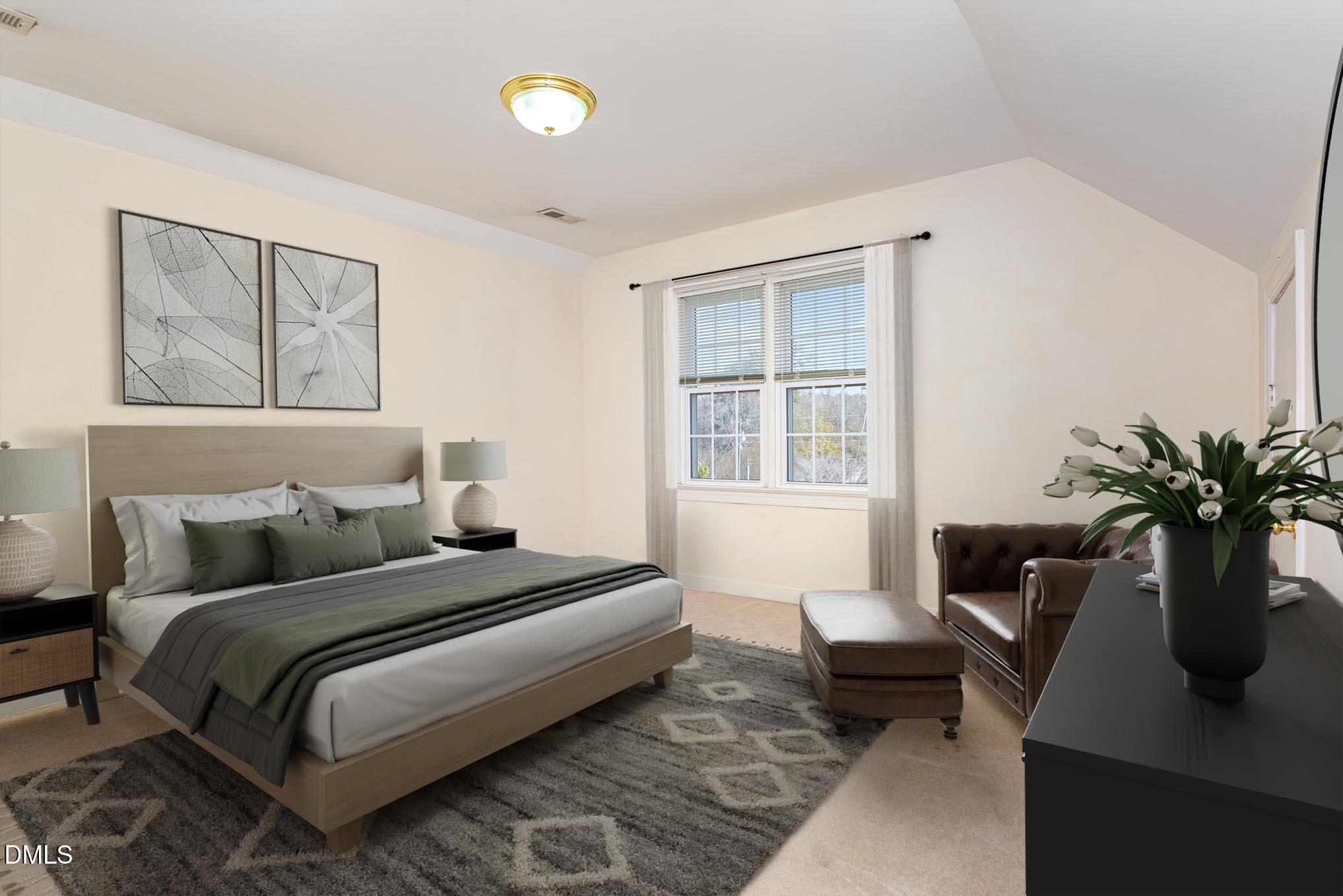 712 Hardimont Road Raleigh, NC 27609 - Photo 27 of 40 a bedroom with a bed table chair and a window