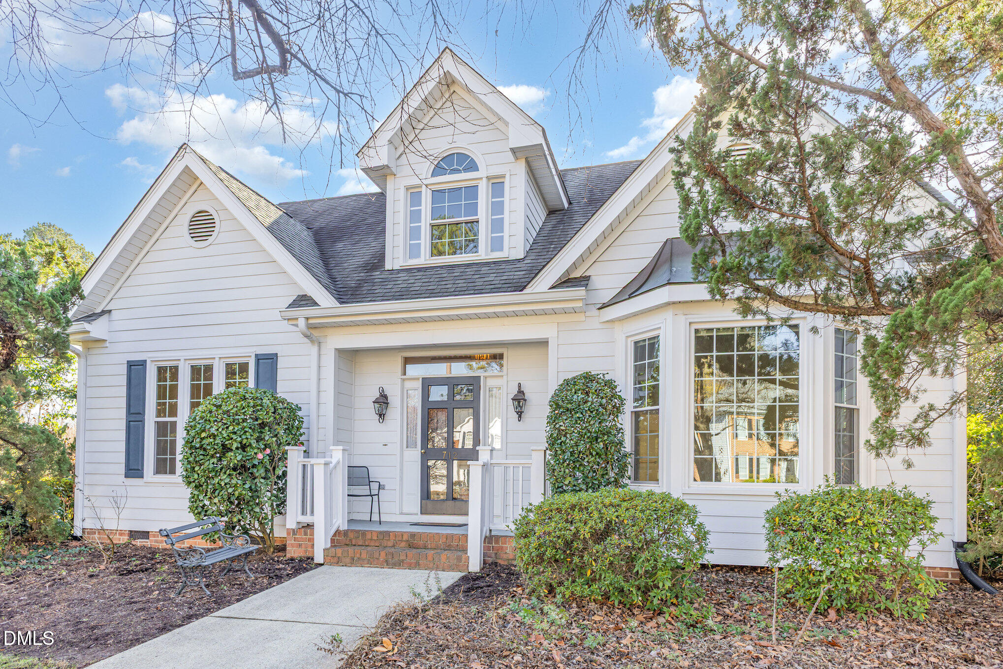 712 Hardimont Road Raleigh, NC 27609 - Photo 2 of 40 a view of a brick house with a large windows and plants