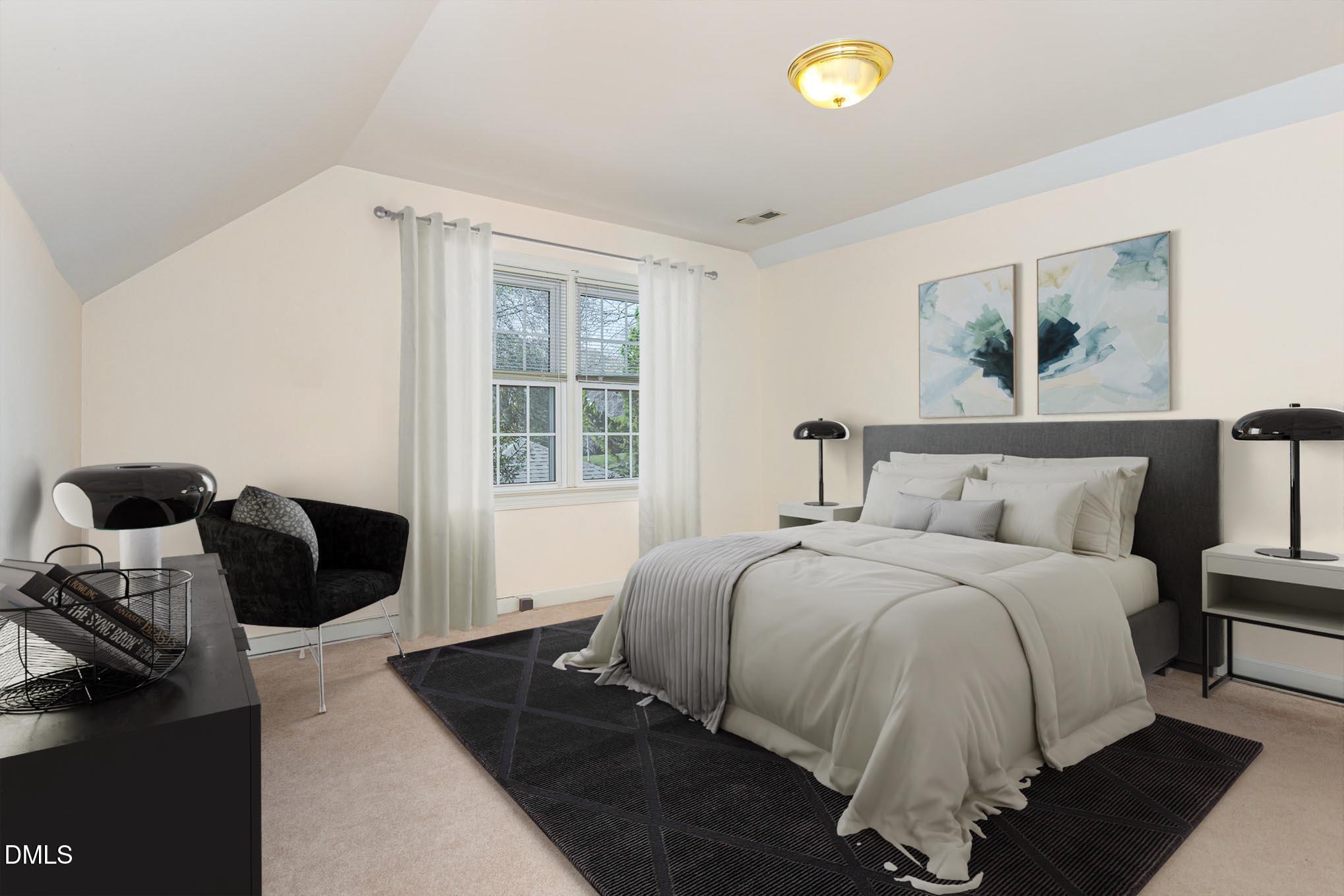 712 Hardimont Road Raleigh, NC 27609 - Photo 29 of 40 a bedroom with a bed and a window