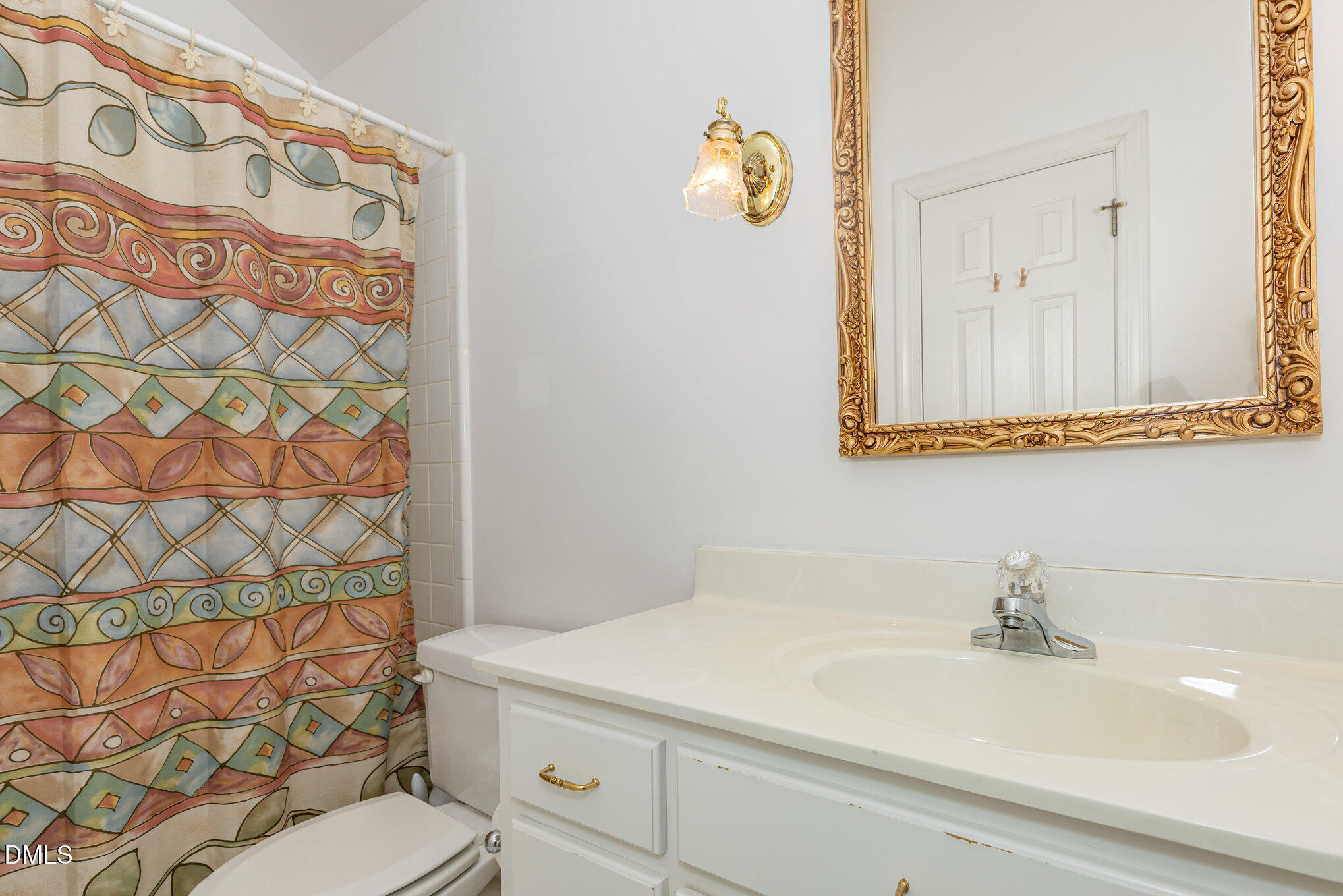 712 Hardimont Road Raleigh, NC 27609 - Photo 31 of 40 a bathroom with a sink and a mirror