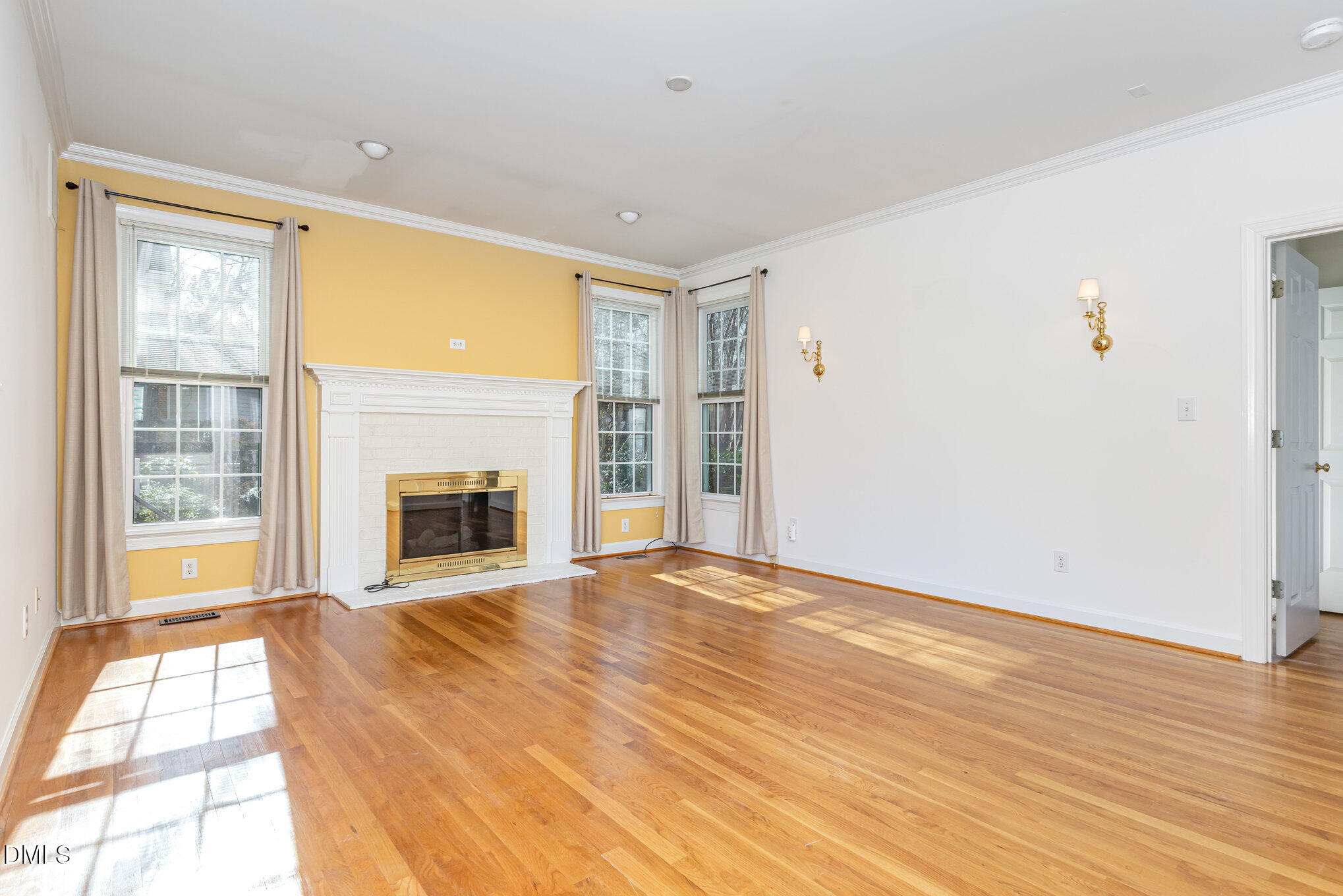 712 Hardimont Road Raleigh, NC 27609 - Photo 7 of 40 a view of an empty room with wooden floor and a window