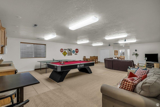 841 1010 S Street St. George, UT 84790 - Photo 19 of 33 Playroom with a textured ceiling, light tile patterned flooring, and billiards table