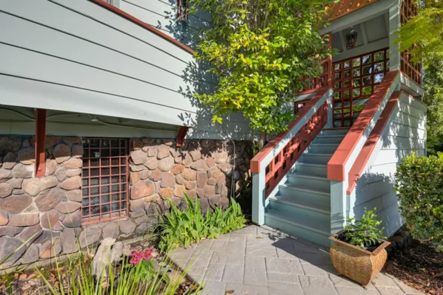 a living room with furniture a fireplace and a table