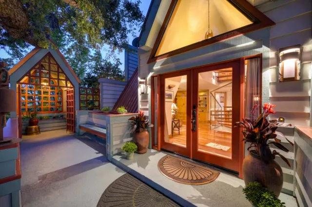 a view of a patio with a table chairs and a backyard
