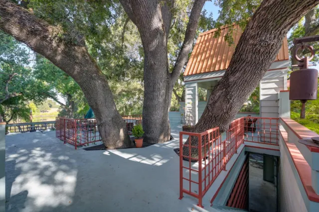 a kitchen stove top oven and cabinets