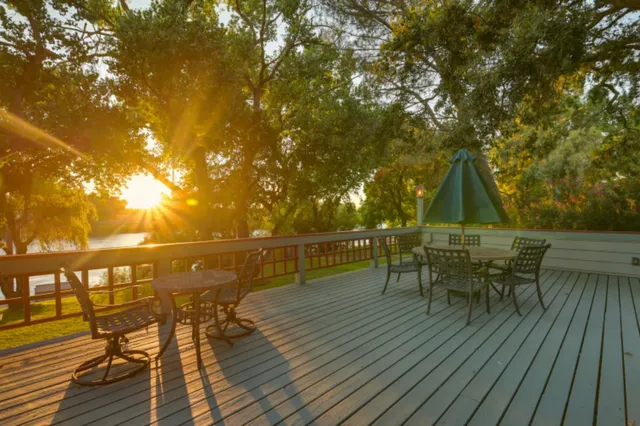 a view of living room filled with furniture and wooden floor