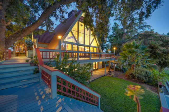 a bathroom with a sink a toilet a mirror and shower