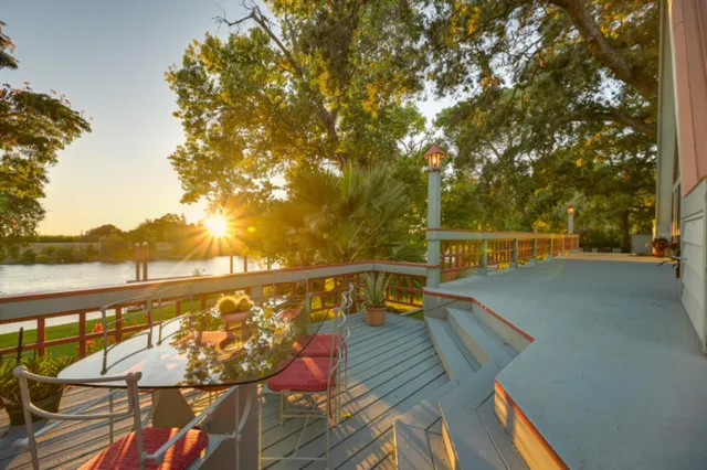 a very nice looking living room with a large window and kitchen view